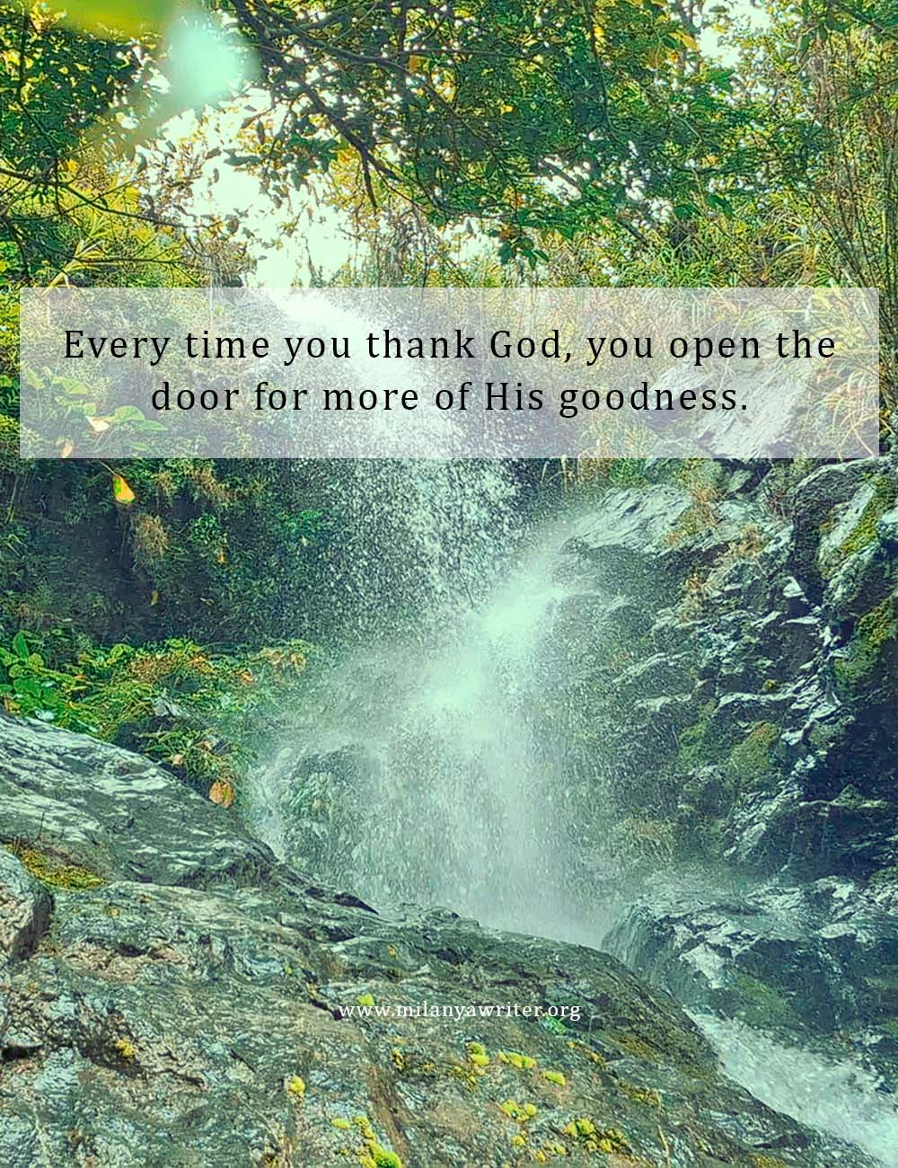 Beautiful waterfall with rock background and the words “Every time you thank God, you open the door for more of His goodness.