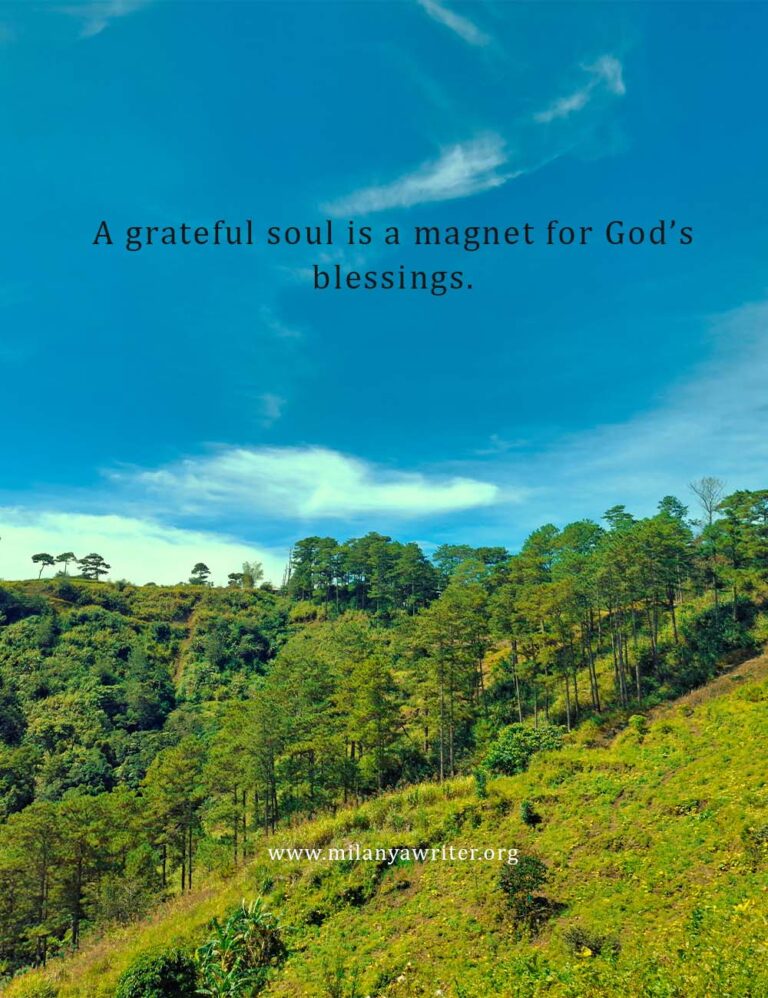 Inspirational Christian quote “A Grateful Soul is a Magnet for God’s Blessings” written over a clear blue sky with trees background.