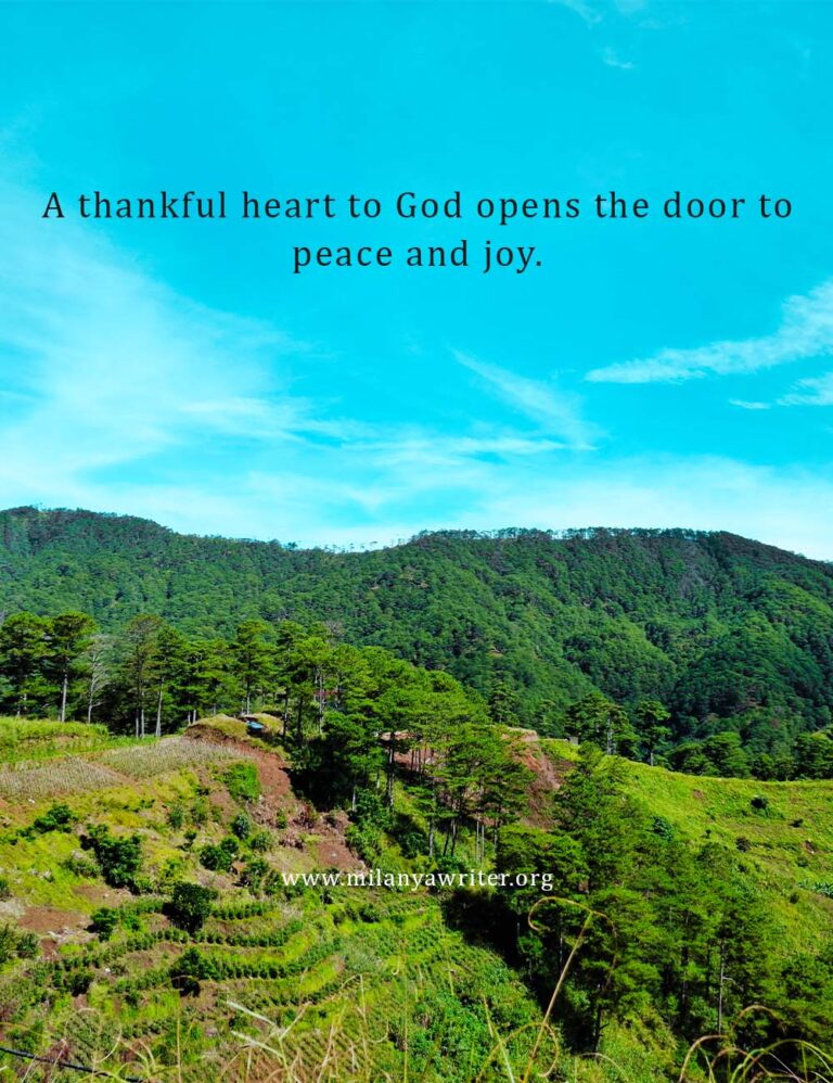 Bible verse “A thankful heart to God opens the door to peace and joy” written on a background of clear blue sky and trees.
